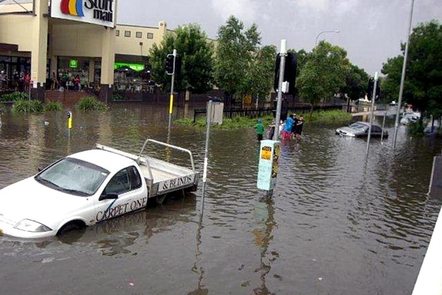 Floodwaters leave cars submerged along Forsyth Street in central Wagga Wagga