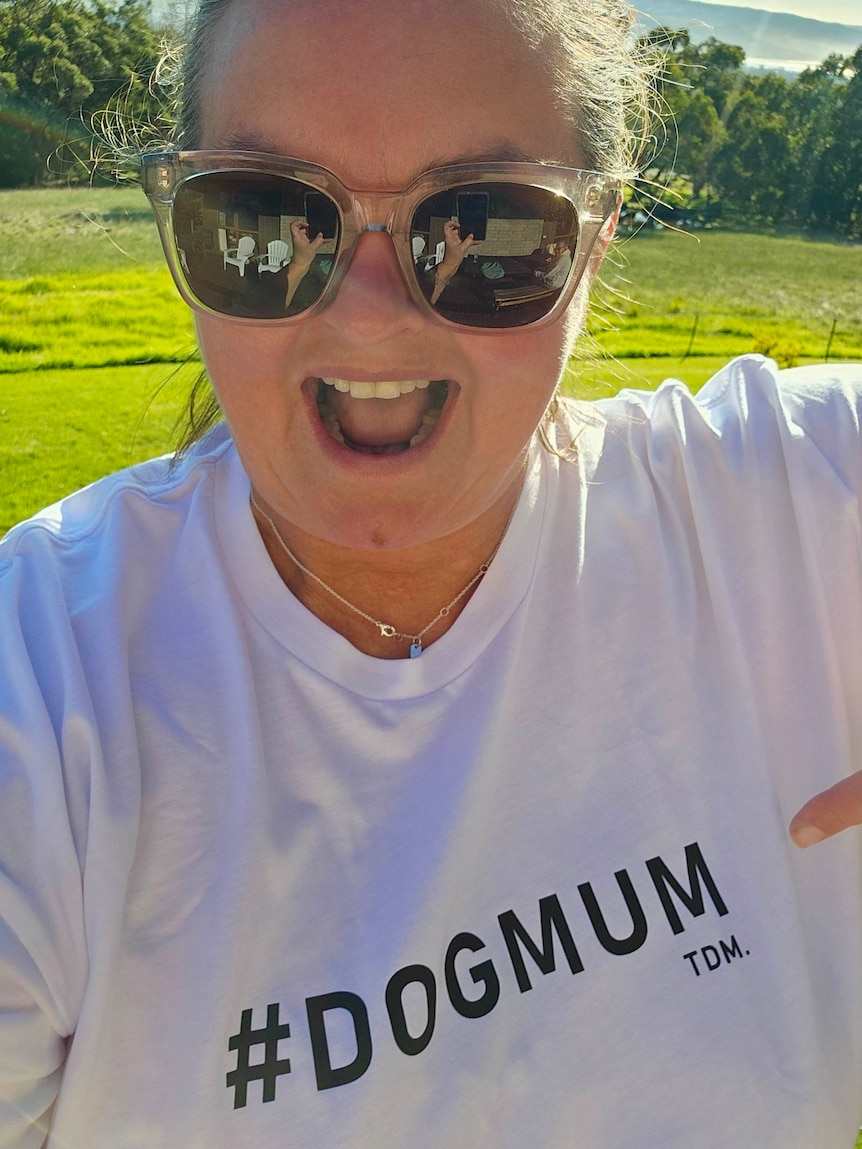 Penny Rabarts takes a selfie with a shirt that says dog mum