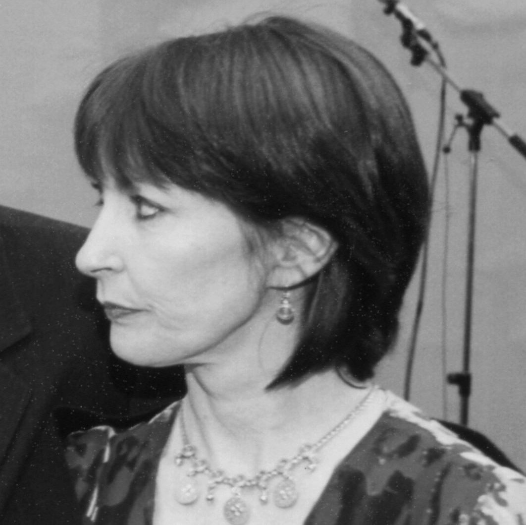 A black-and-white image of a middle-aged woman.