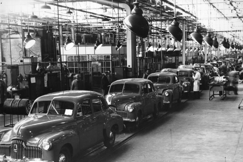 Black and white photo of 1950s Holden cars on the assembly line in Melbourne
