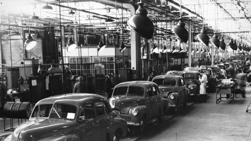 Black and white photo of 1950s Holden cars on the assembly line in Melbourne