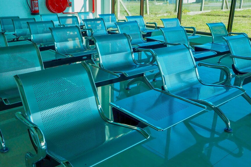 Empty chairs in an airport terminal
