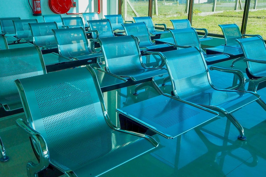 Empty chairs in an airport terminal