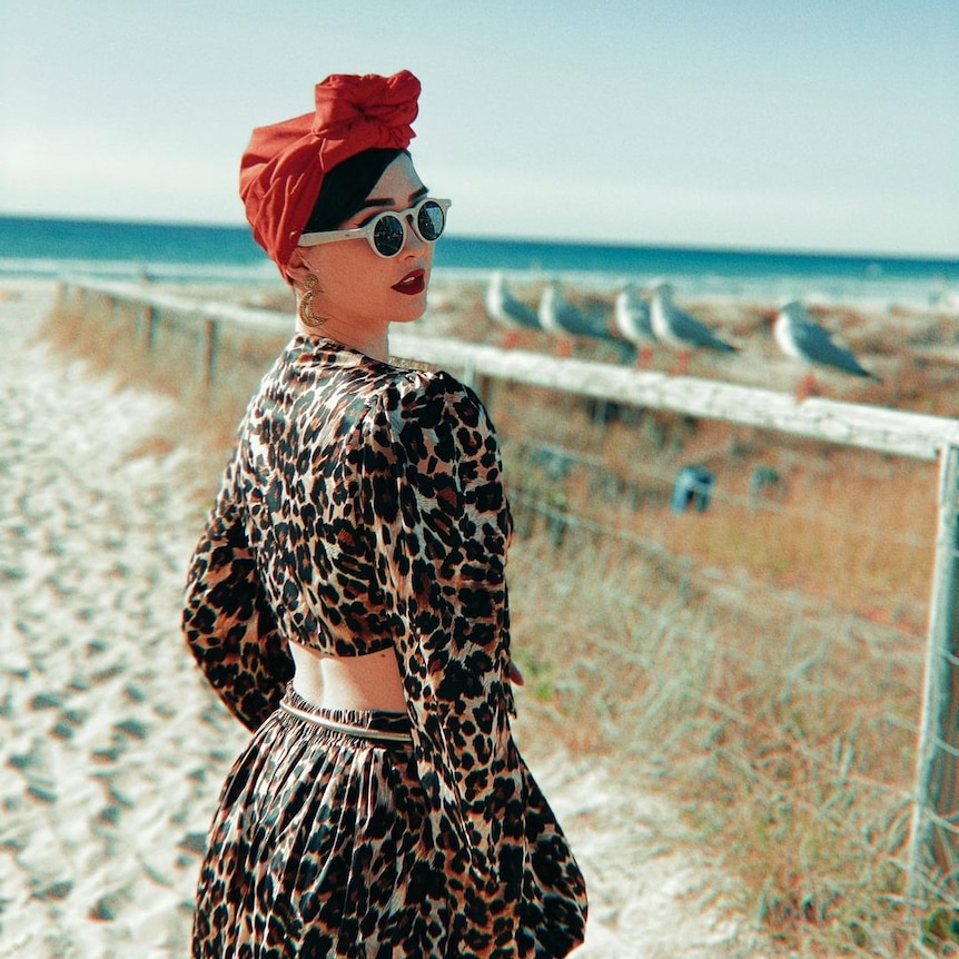 woman in hat and sunglasses