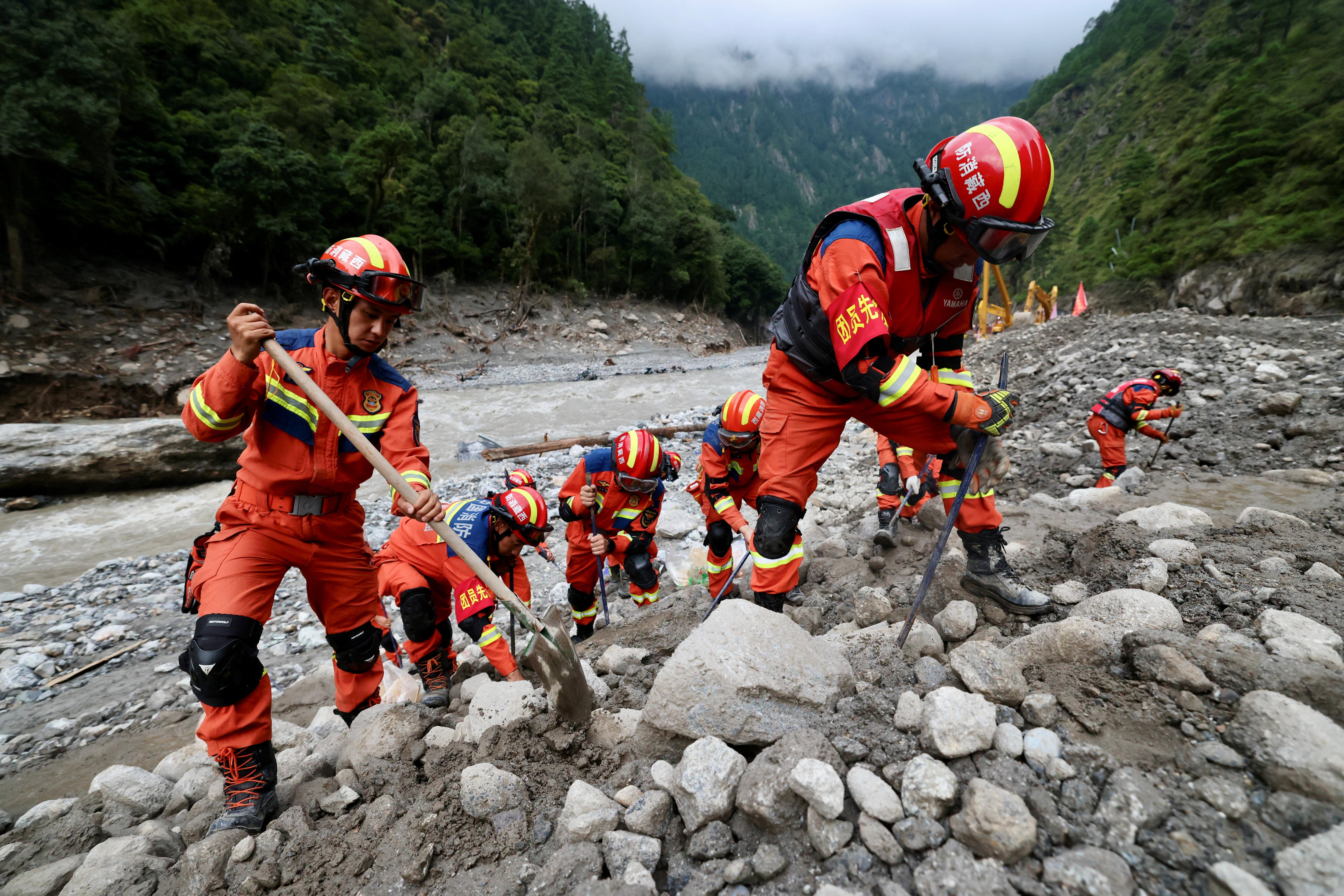 Live: Search continues for thousands missing, including at least 41 Australians