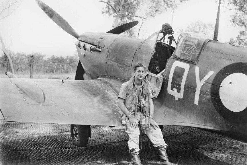Flight Sergeant Colin Duncan sits in front of his plane, which crashed at Litchfield National Park in 1943.