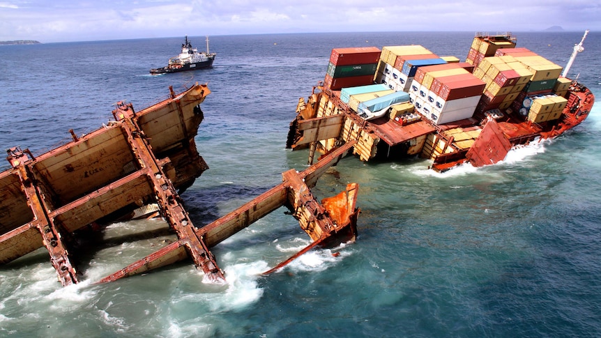Stricken container ship Rena slips off a reef in the Bay of Plenty
