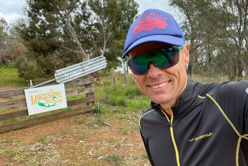 Former cricketer Johan Botha poses for a selfie in a rural setting. 
