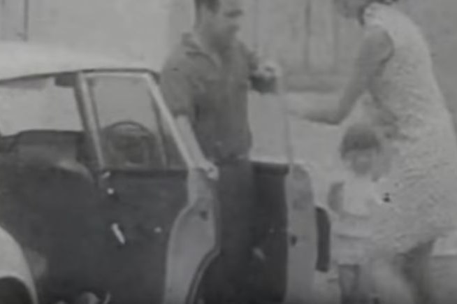 Still image from David Brill film of family fleeing Tasmanian bushfires, 1967.