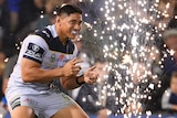 Jason Taumalolo in front of fireworks