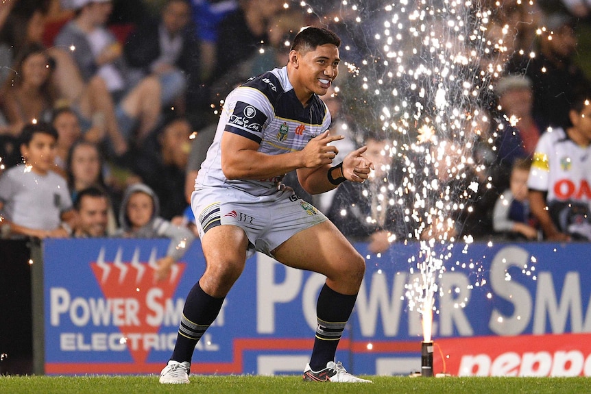 Jason Taumalolo in front of fireworks