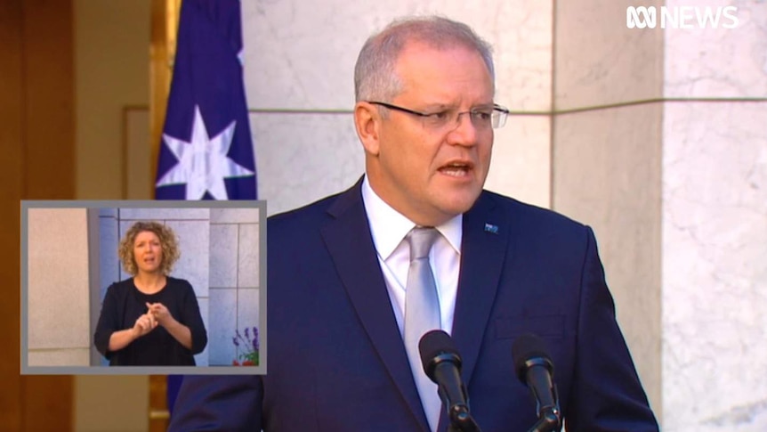 A screenshot of Prime Minister Scott Morrison's press conference, with a picture-in-picture box featuring an Auslan interpreter.
