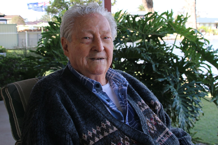 Bill Hamburger Snr sits in a chair outside his retirement home in Sussex Inlet.