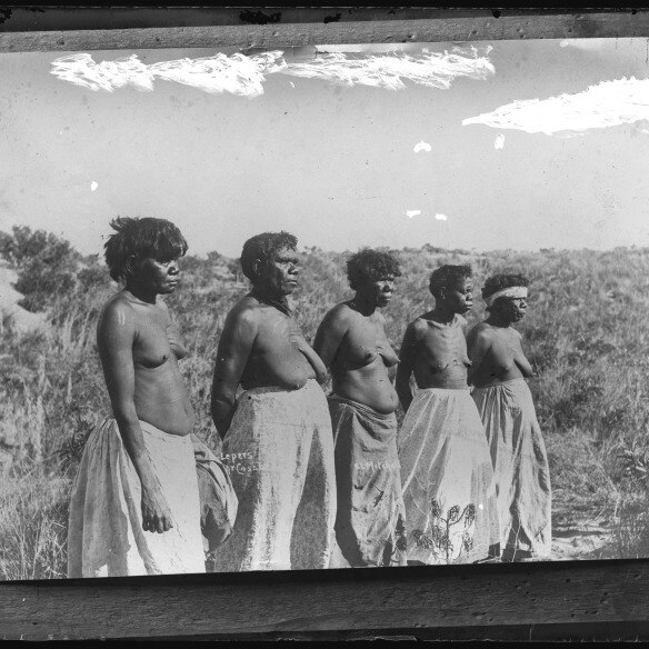 A black and white photo of five indigenous people 