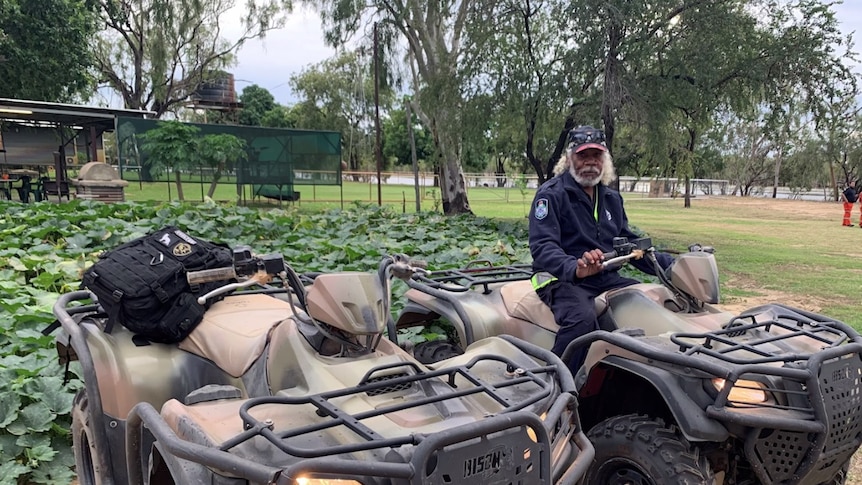 Police liaison officer sitting on a four wheeler.