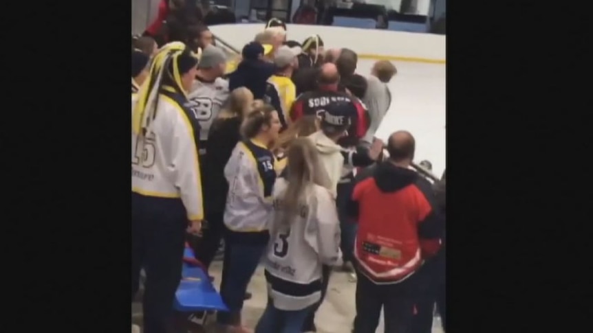 Fans from both teams converged after a bin was thrown at Peter Chamberlain. (Facebook: Adam Van Bael)