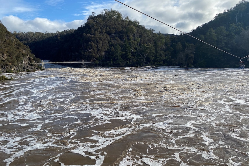 Swollen waterway as seen from a chairlift ride.