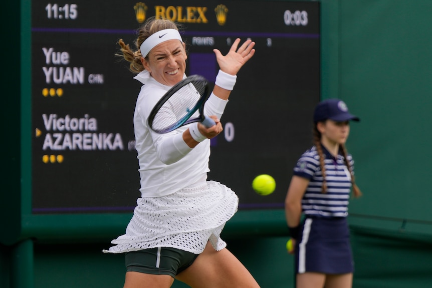 Victoria Azarenka hits a forehand at Wimbledon.