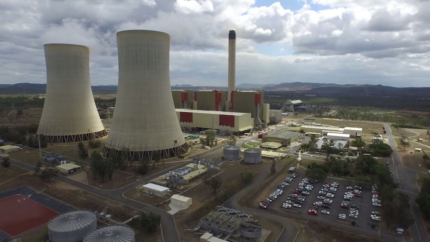 Aerial shot of the Stanwell power station, with cooling and smoke stacks and car park.