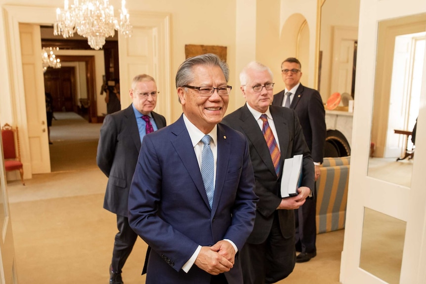 SA Governor Hieu Van Le in the foreground followed by royal commissioner Bret Walker at Government House.