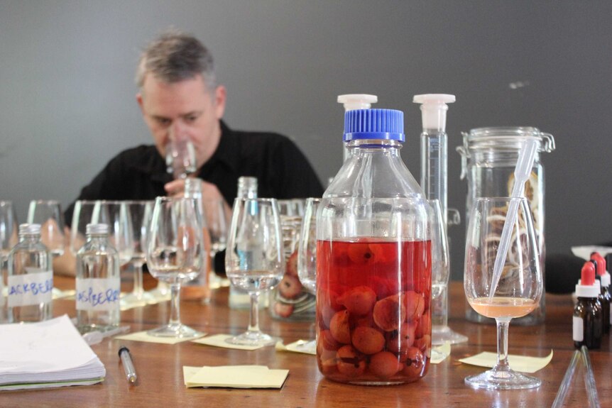 WA distiller Cameron Symes puts the finishing touches on quandong gin