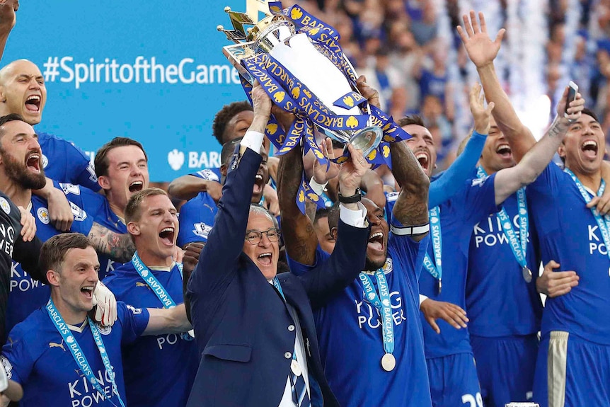 Leicester City's Claudio Ranieri and Wes Morgan lift Premier League trophy