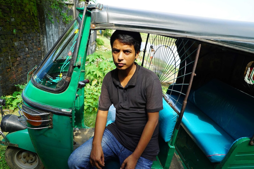 Rohingya driver Shohid Ullah sits in his tuk tuk