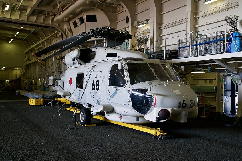 A helicopter sits inside the IZumo.