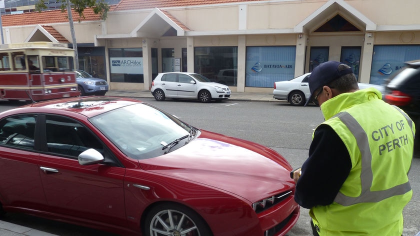 City of Perth parking inspector handing out ticket