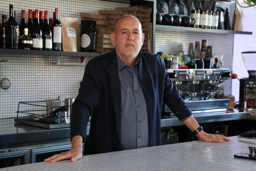 A portrait of Peter Newson sitting at the bar, daytime