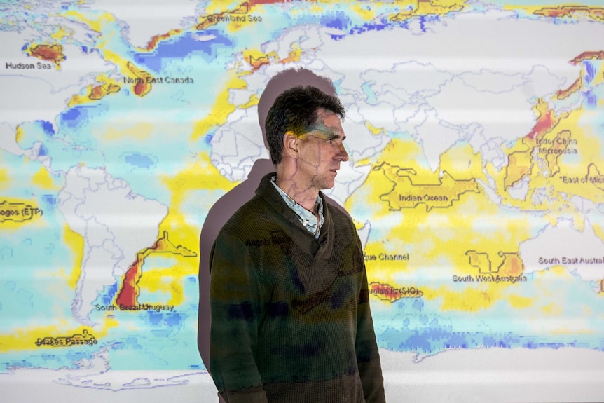 Alistair Hobday with heatwave maps in the background