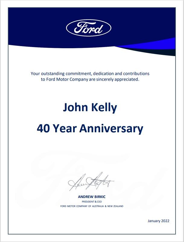 A certificate congratulating John Kelly on working 40 years at Ford.