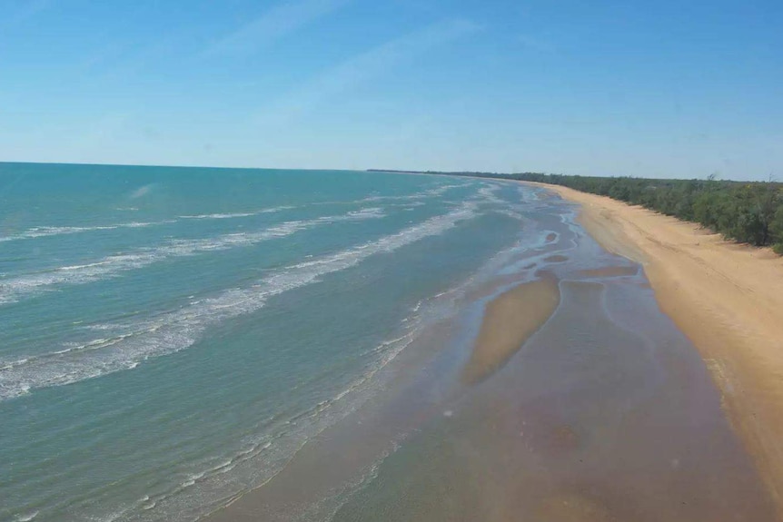 an aerial photo of a long beach.