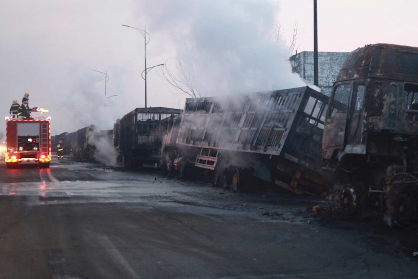 Destroyed vehicles in the aftermath of a deadly chemical plant blast in north-eastern China.