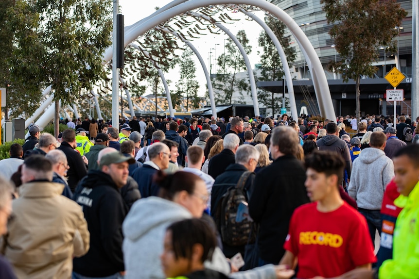 A crowd of people outside Perth Stadium.