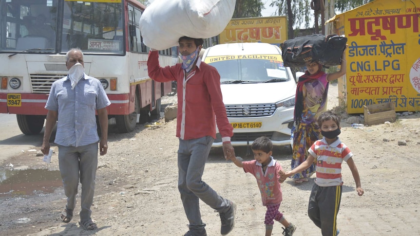 Migrant workers in India returning home amid the nationwide lockdown to curb the coronavirus.