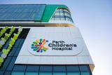 The side of Perth Children's Hospital, with a sign showing the building's name.