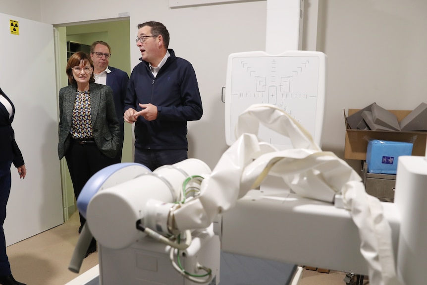 Premier Daniel Andrews and Minister for Health Mary-Anne walk into a room in a health clinic.