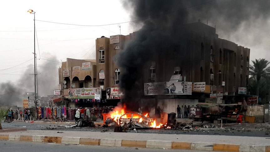 Scene of car bombing in Baghdad suburb