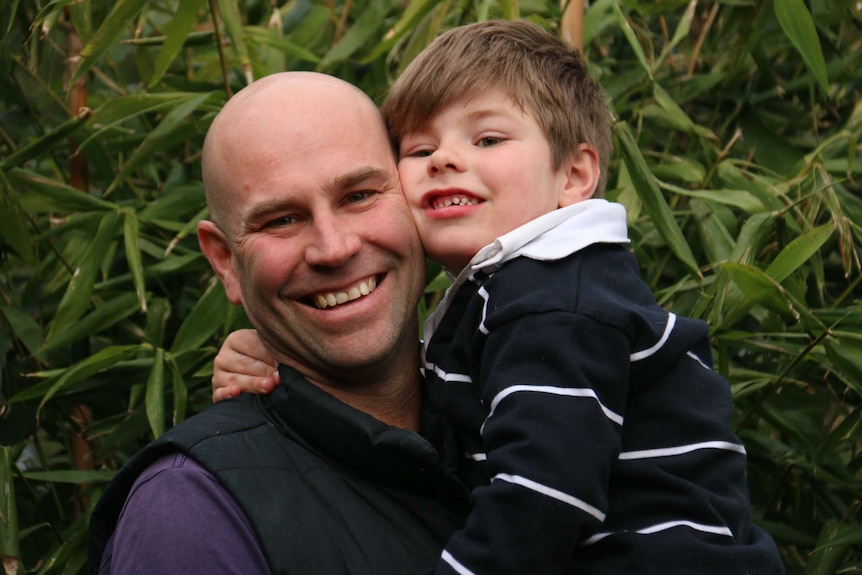 Michael and Max Shearman have a hug