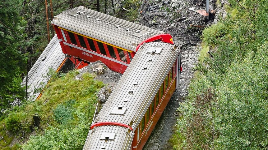 Swiss train derails after mudslide