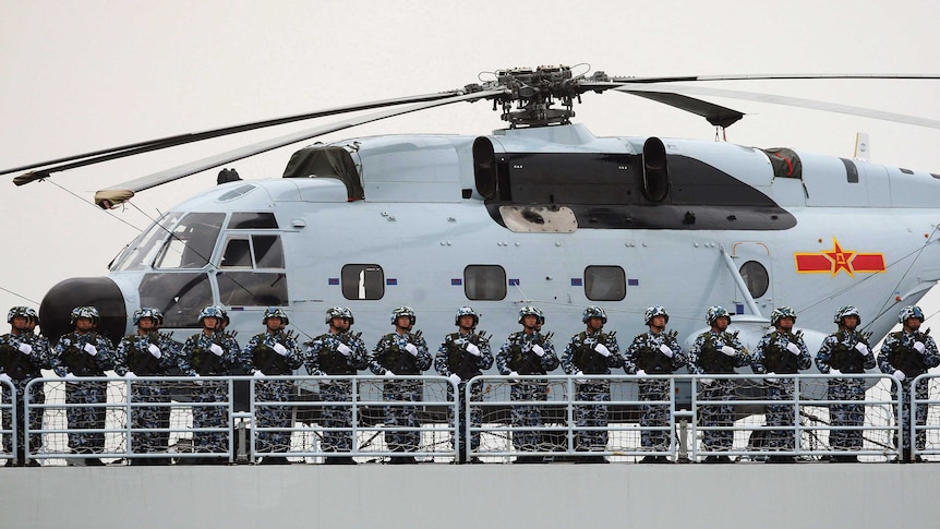 Chinese Marines stand on a warship