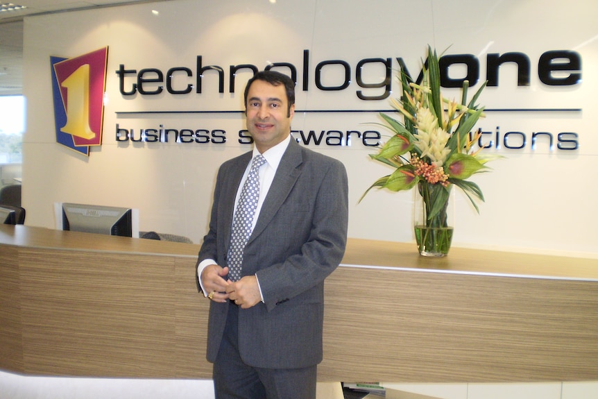 Man standing at TechnologyOne office in Victoria. 