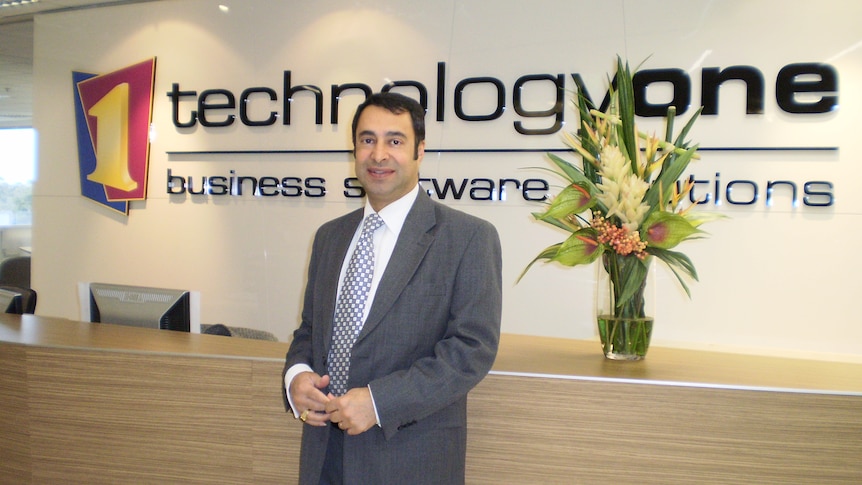 Man standing at TechnologyOne office in Victoria. 