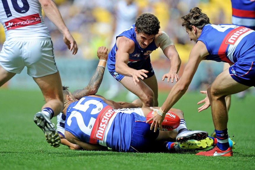 Tom Liberatore and Marcus Bontempelli win the loose ball for the Western Bulldogs