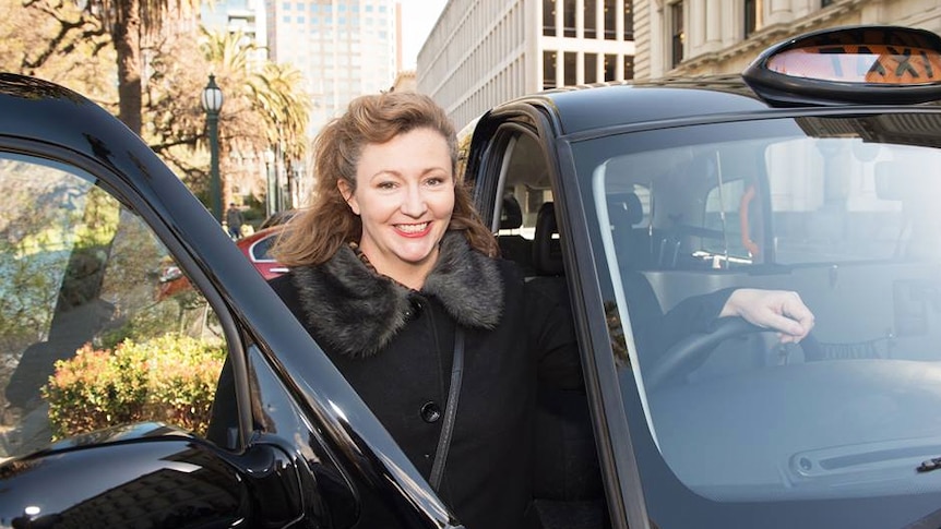 The founder of Shebah Georgina McEncroe climbs into a taxi.