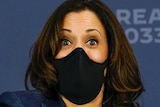 Democratic vice presidential candidate Kamala Harris participates in a roundtable discussion while wearing a mask