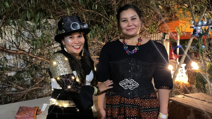 Two Asian women in Steampunk celebrating their national dress. 