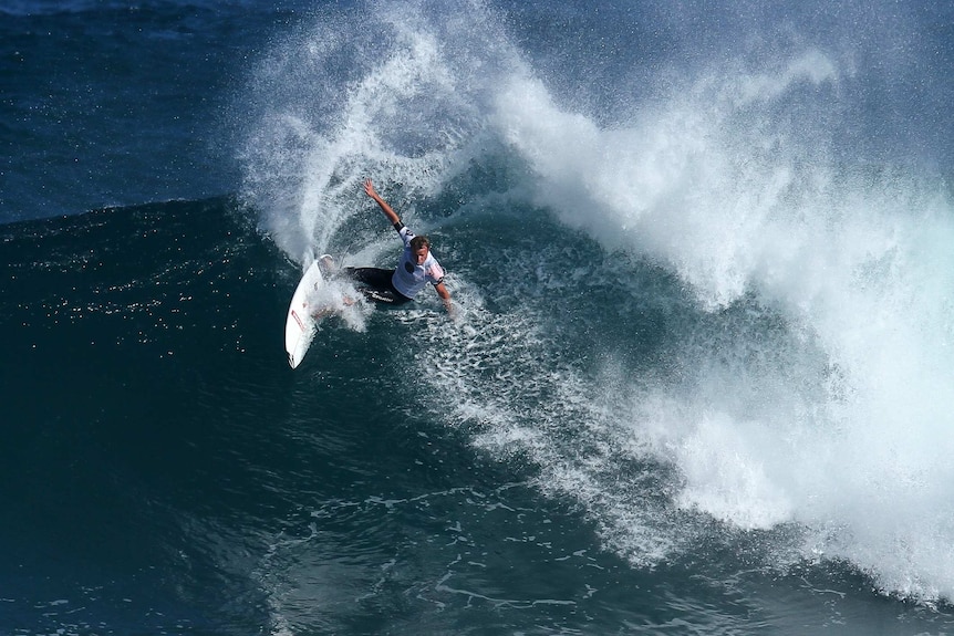 Taj Burrow surfs