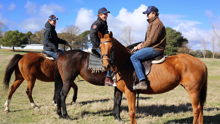 Three men on horses